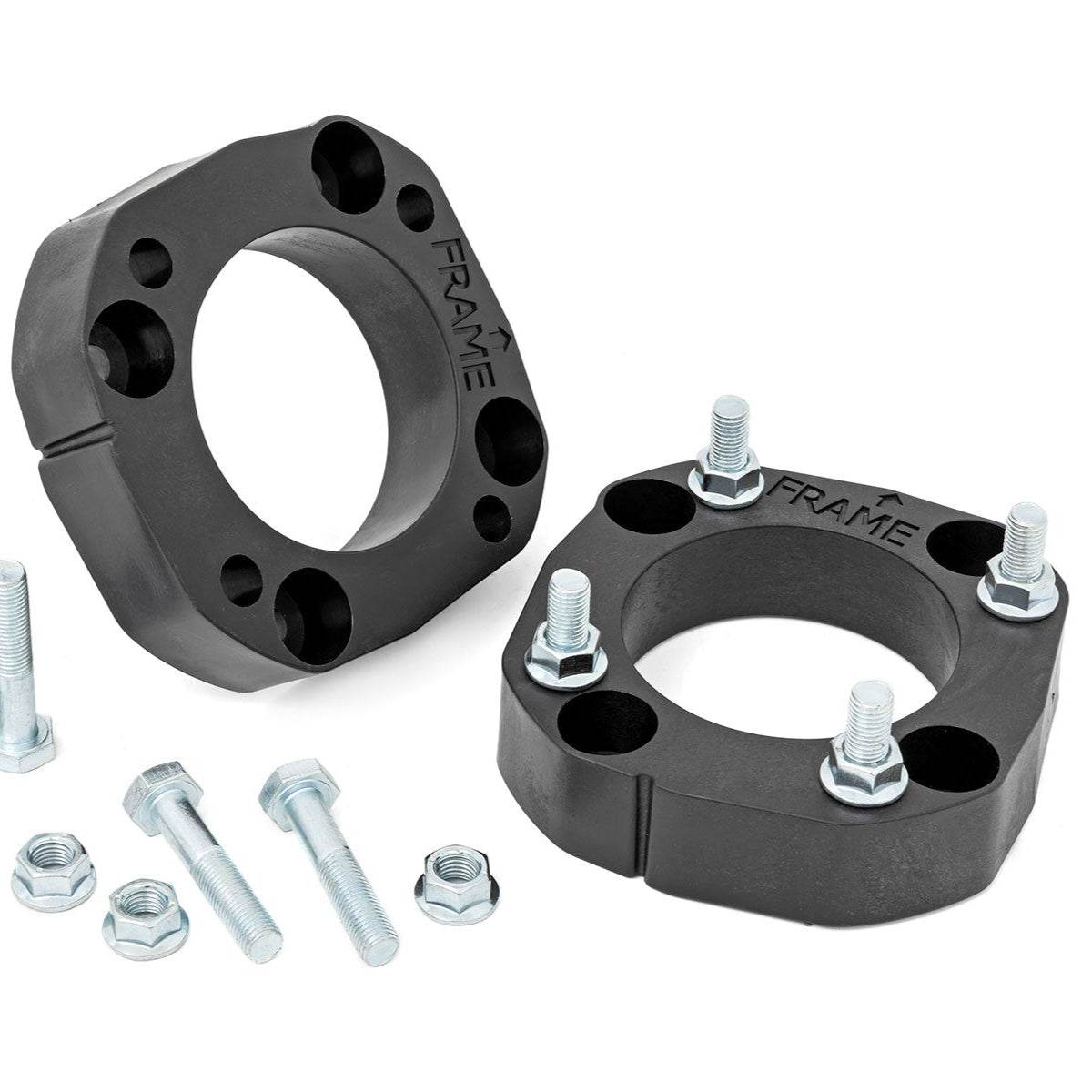 Two black wheel spacers with accompanying bolts on a white background