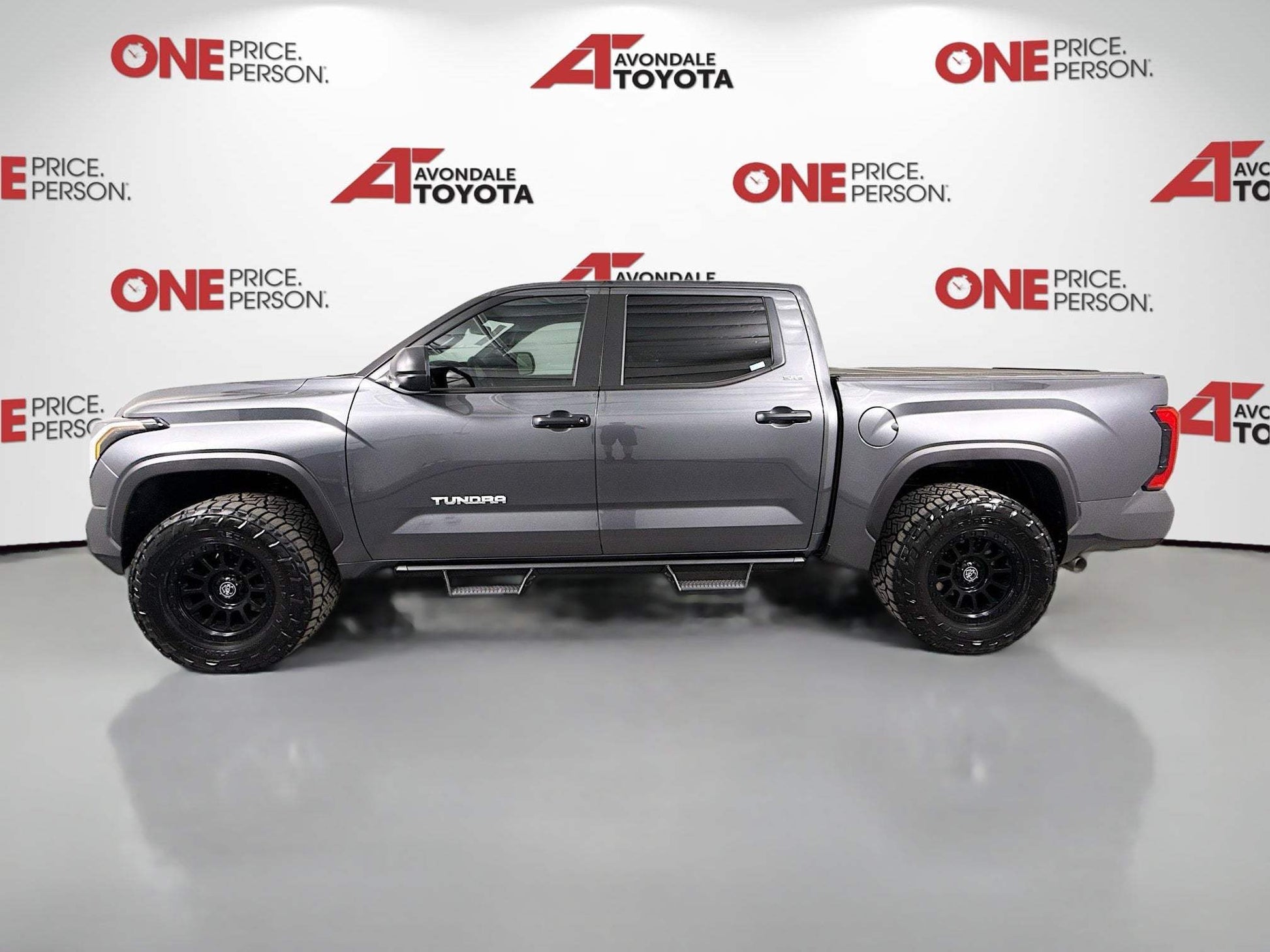 2025 Toyota Tundra with dealer-installed 1.75-inch front level lift package and black off-road wheels for lifted trucks
