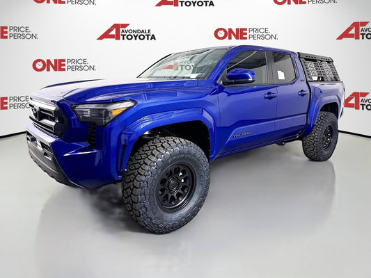 Blue 2025 Toyota Tacoma with 2.5-inch Ready Lift and off-road tires installed by dealership