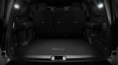 Dealer installed cargo lights illuminating vehicle cargo area for enhanced visibility and safety