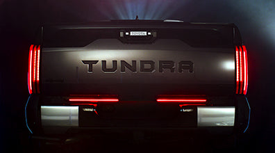 LED tailgate light bar on Toyota Tundra providing tail, stop, backup, sequential turn and hazard lights