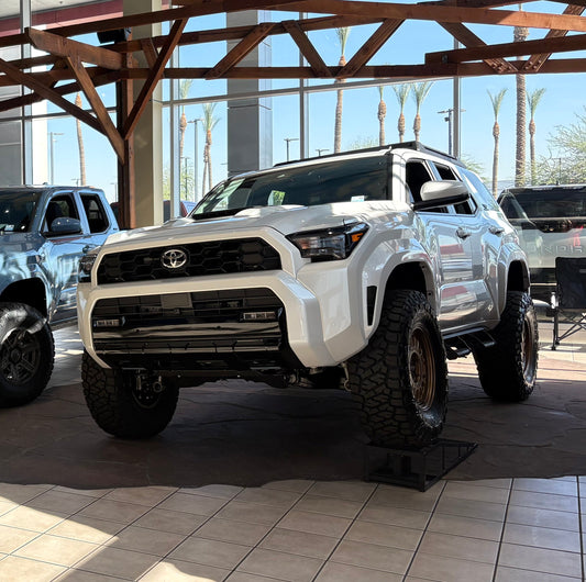 2025-2026 Toyota 4Runner TRD with dealer-installed 2.5-inch front and 1.5-inch rear lift kit for enhanced ground clearance and off-road angles