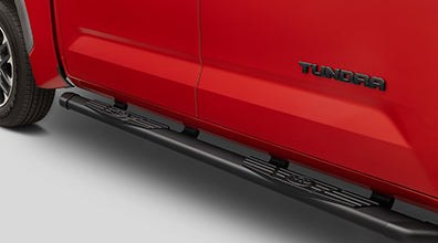 2025 Tundra truck with dealer-installed black side steps for easy entry and rugged durability