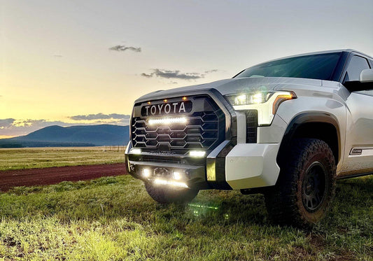 Toyota truck with TRD Pro Grille Conversion Kit and integrated light bar at sunset