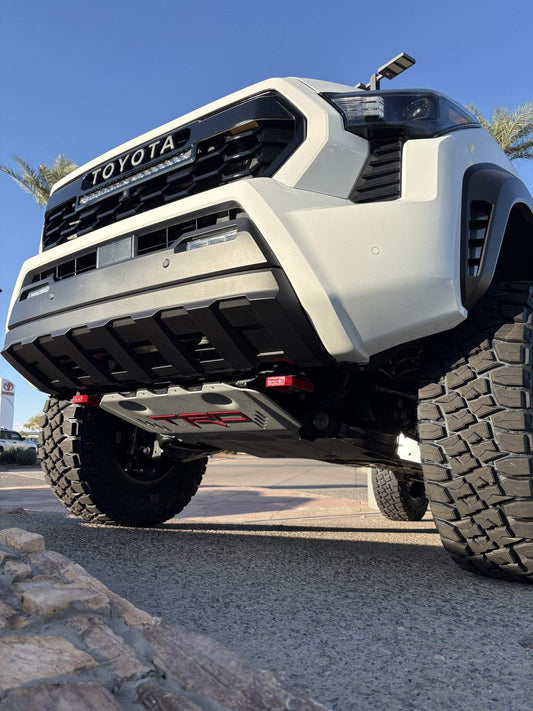 Toyota truck with TRD Front Skid Plate protecting the undercarriage during off-road driving